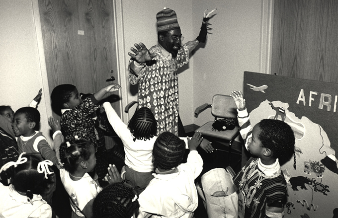 man dancing with children